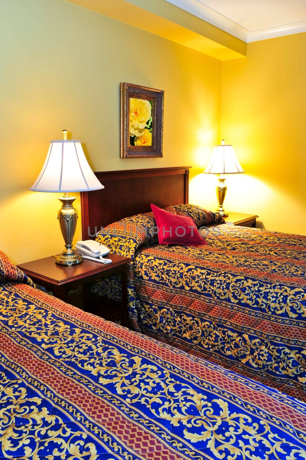 Bedroom interior with two double beds, images on the wall are my own.