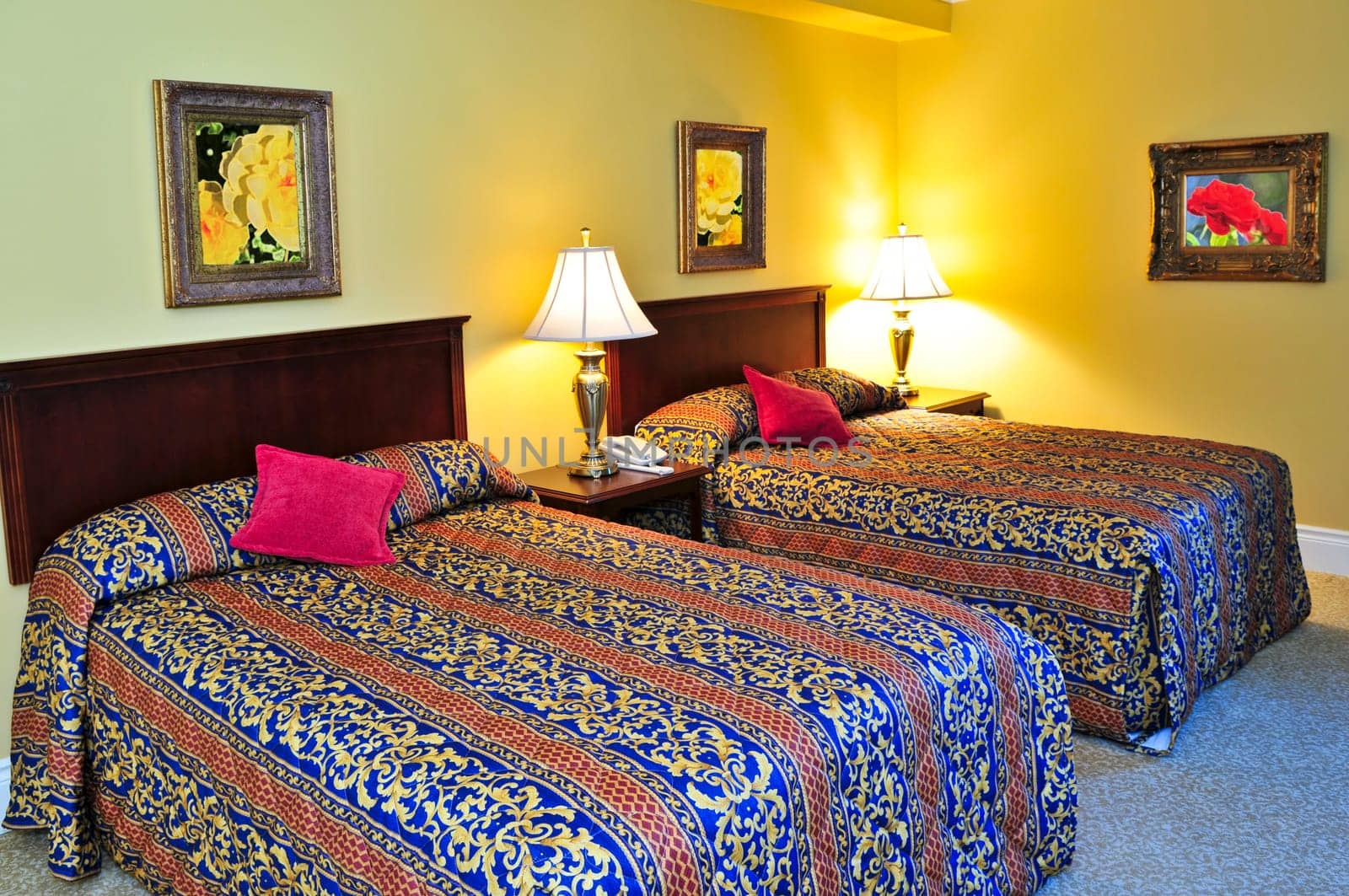 Bedroom interior with two double beds, images on the wall are my own.