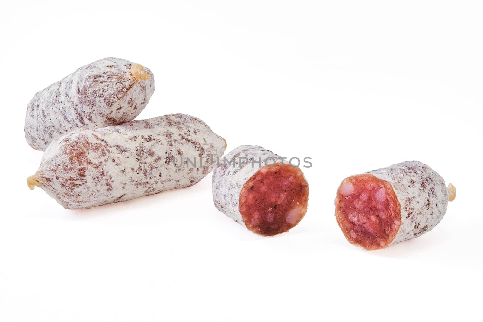 Closeup view of fermented mini parma sausages covered with white mold