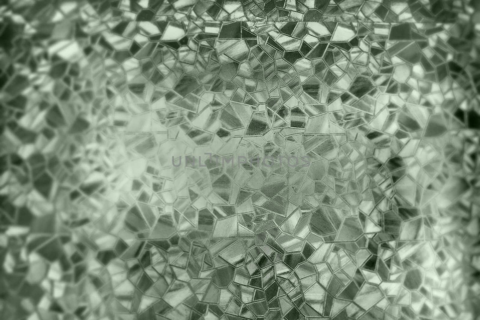 Corrugated glass green background. Abstract pattern on the surface of a window. Protective opaque film