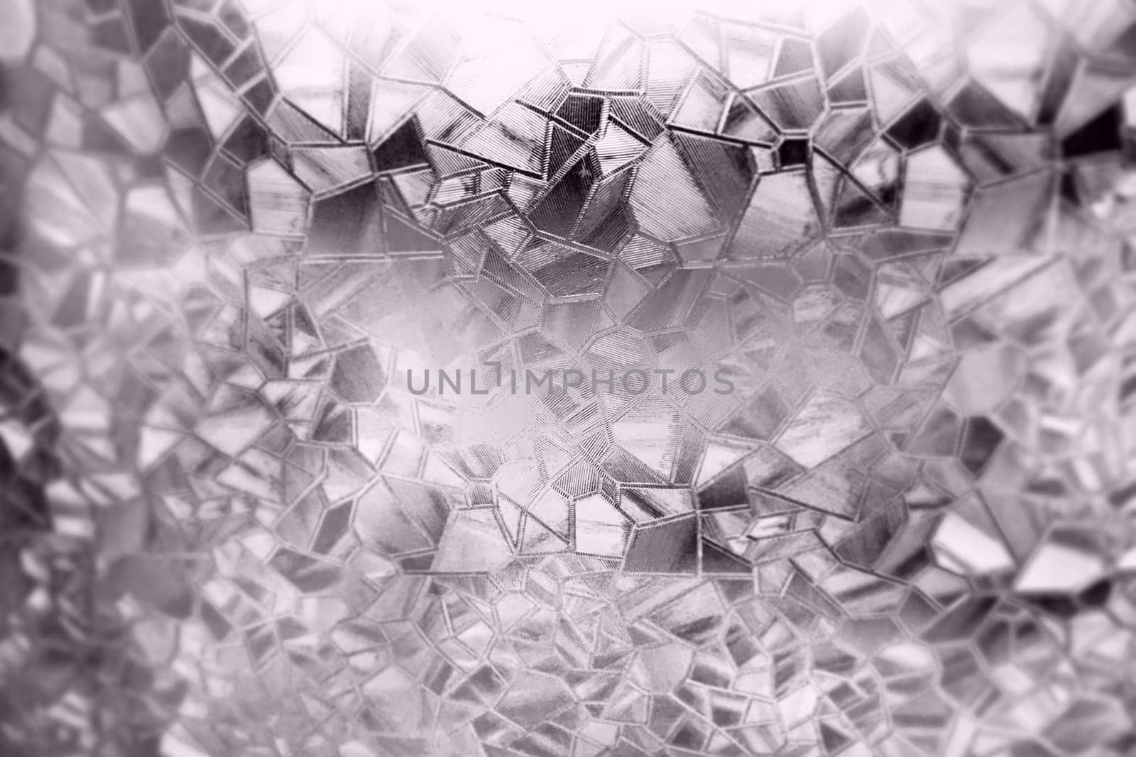 Embossed glass background. Corrugated glass sepia monochrome. Refraction of light in a bumpy transparent surface under backlight. The play of highlights. Black brown areas. Abstract background.