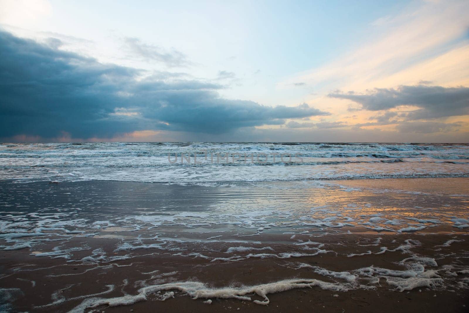 Wadden sea at low tide, North sea beach landscape, coast on Romo island in Denmark at sunset, vacation und lifestyle