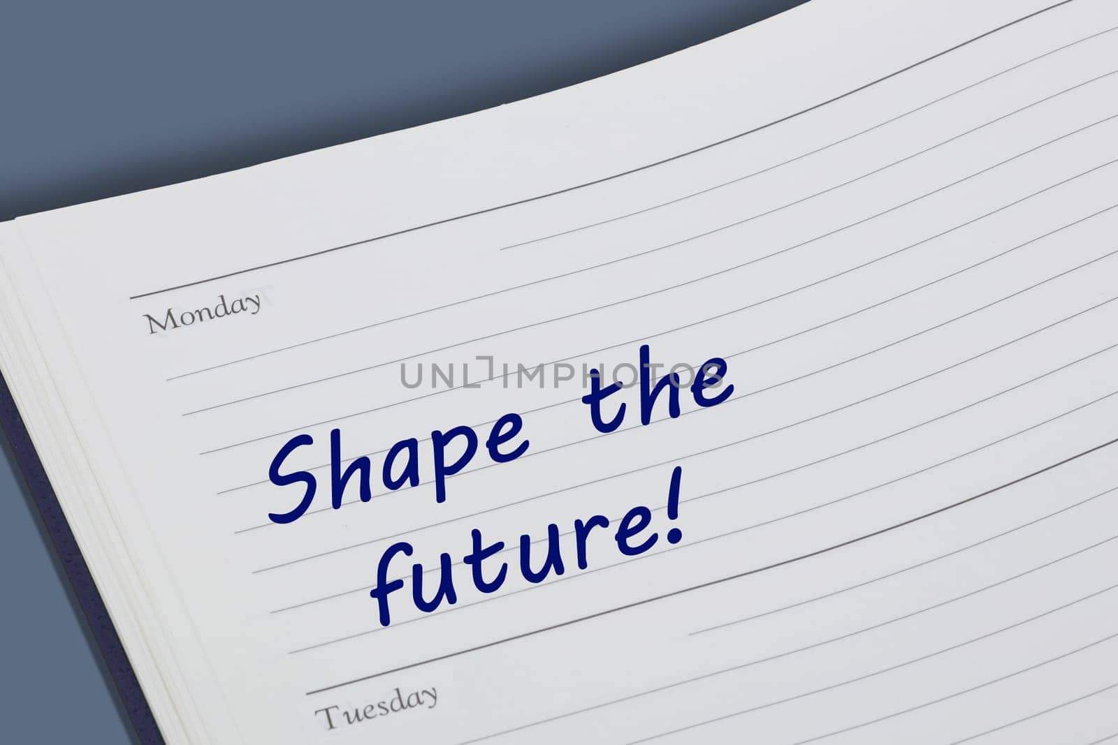 A Shape the future reminder message open on desk