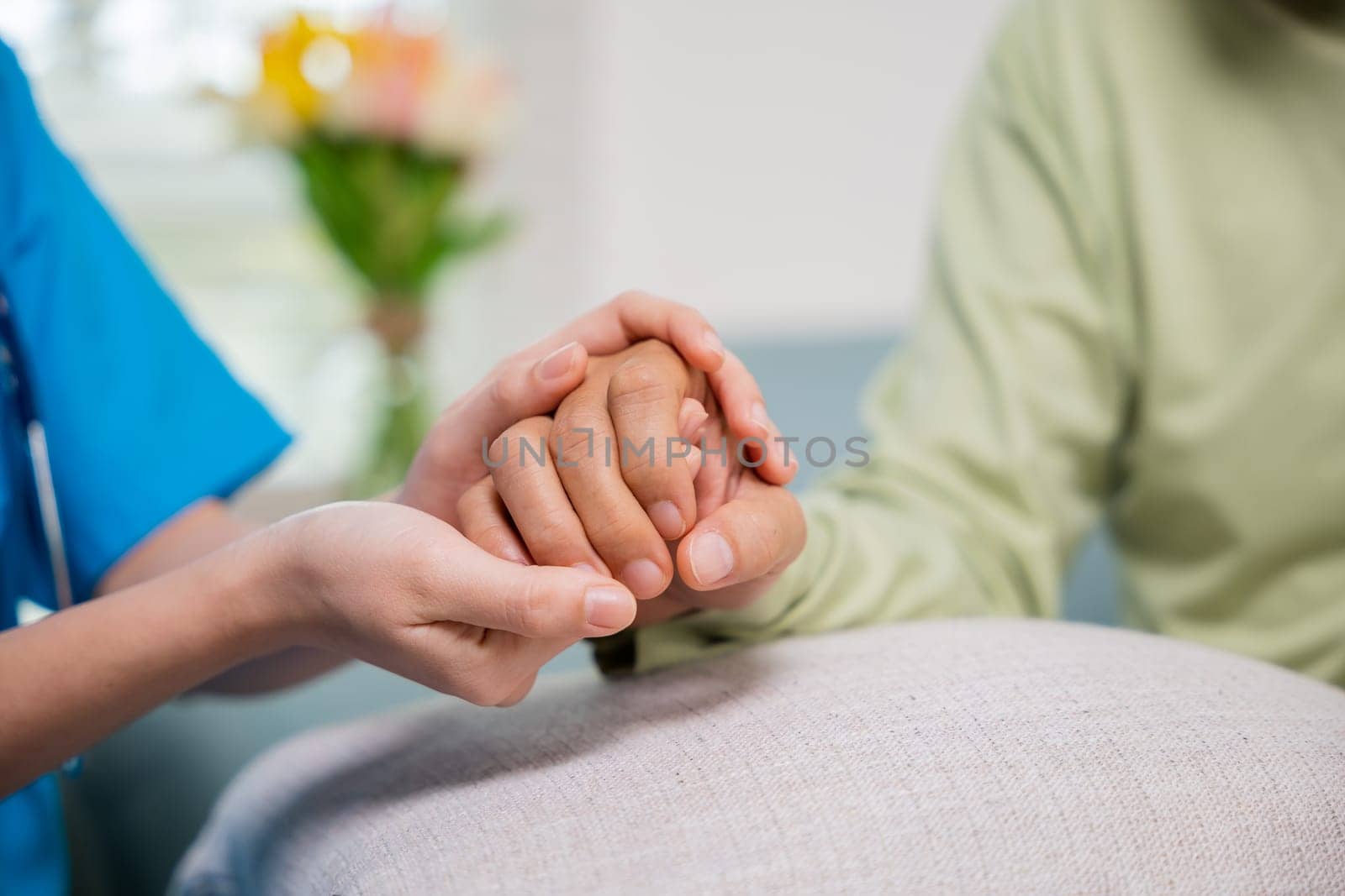 International Day for the Elderly. Caring nurse helping elderly old man care facility gets help from hospital, young woman helping hands offering her senior man at home, old aged