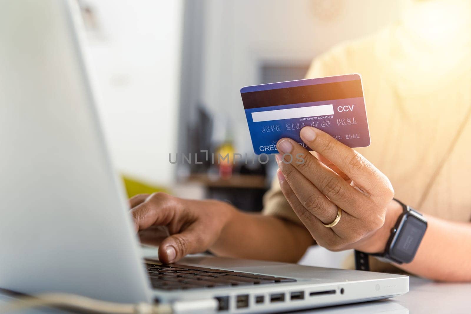 Online shopping. Woman hands holding credit card and using laptop with product purchase at home, female register via credit cards on computer to make electronic payment security online