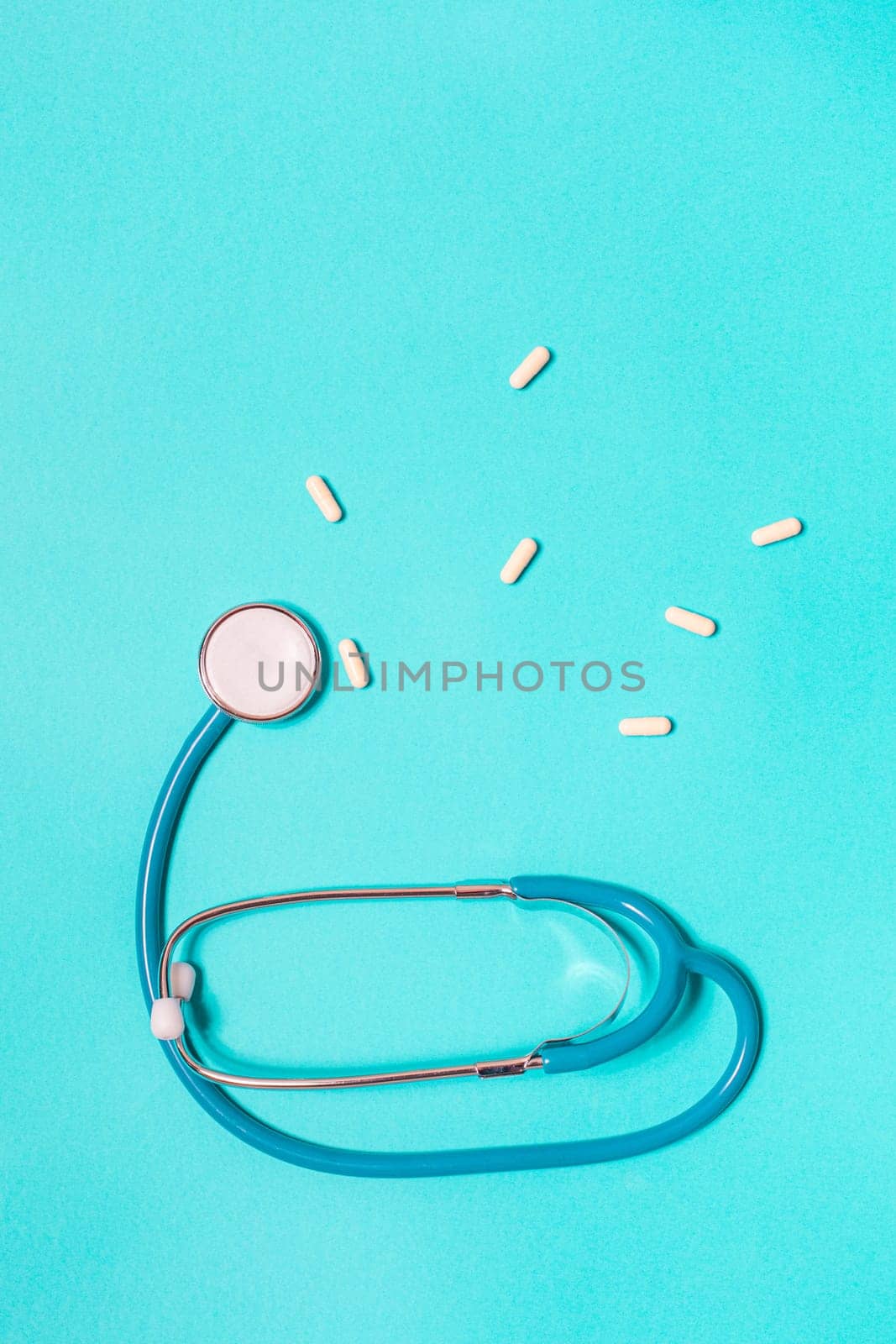 Medicine debate concept. Biotechnology banner with medical stethoscope and pills. Copy space for text. flatlay.