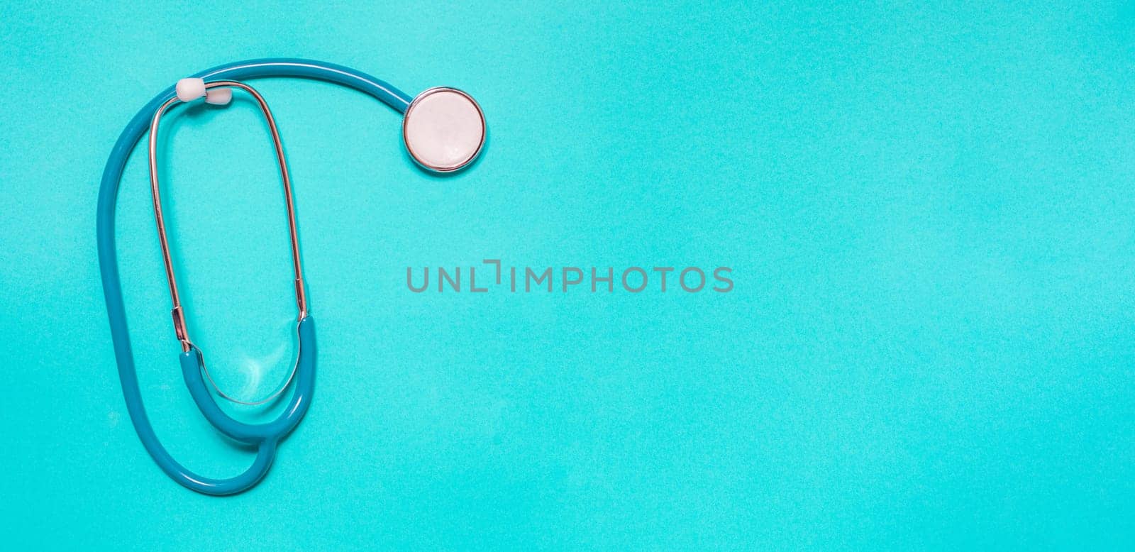 Medicine debate concept. Biotechnology banner with medical stethoscope and pills. Copy space for text. flatlay.