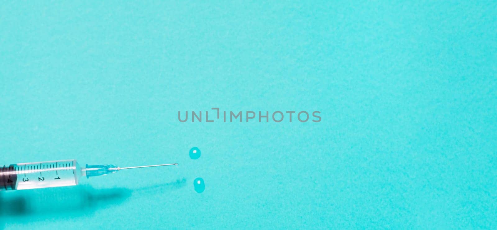 Vaccination debate concept. Biotechnology banner with medical syringe. Copyspace for text. flatlay.