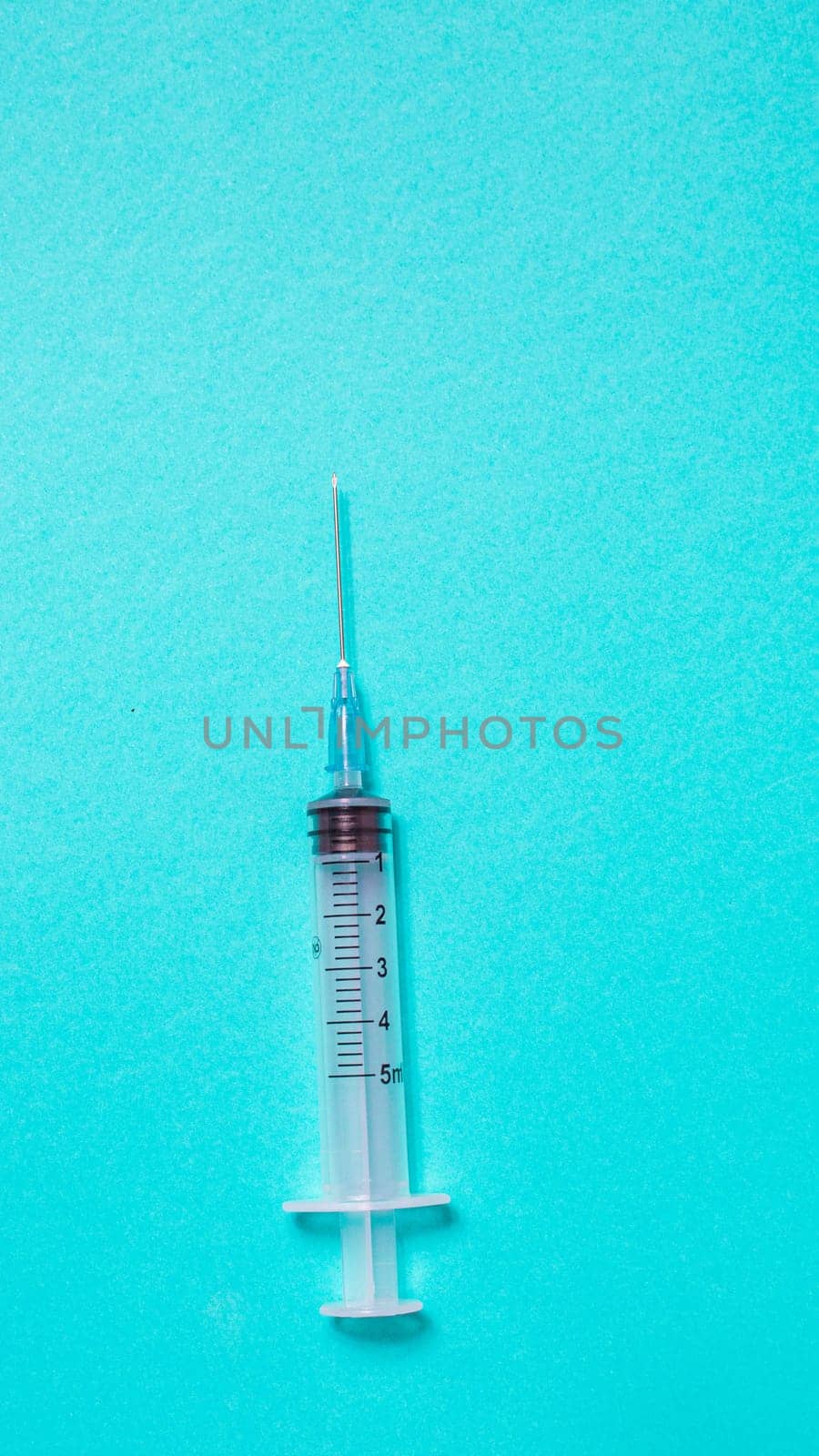 Vaccination debate concept. Biotechnology banner with medical syringe. Copyspace for text. flatlay.