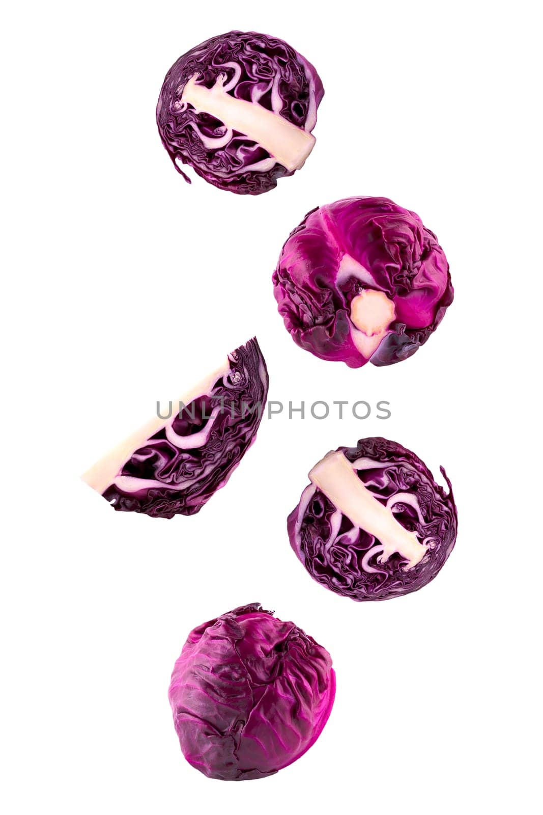 Isolated flying vegetables. Five whole and sliced red chicory falling on white with clipping path as package design element and advertising. Full depth of field.