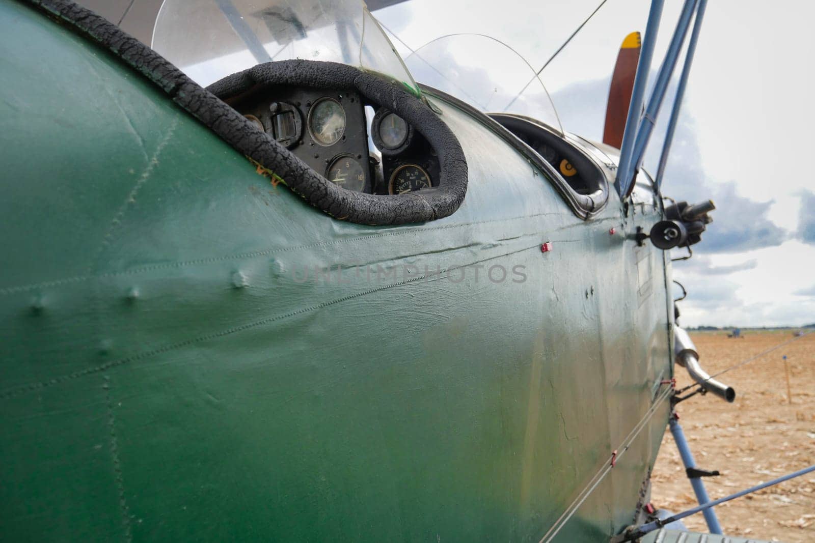 a green painted propeller plane