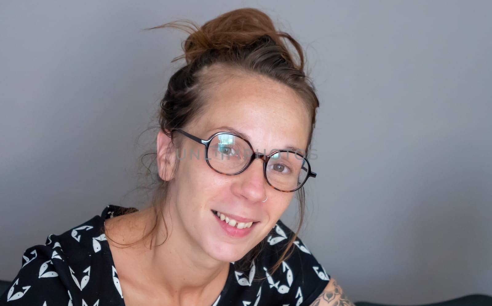 a portrait of 35' years old pretty woman with eyeglasses