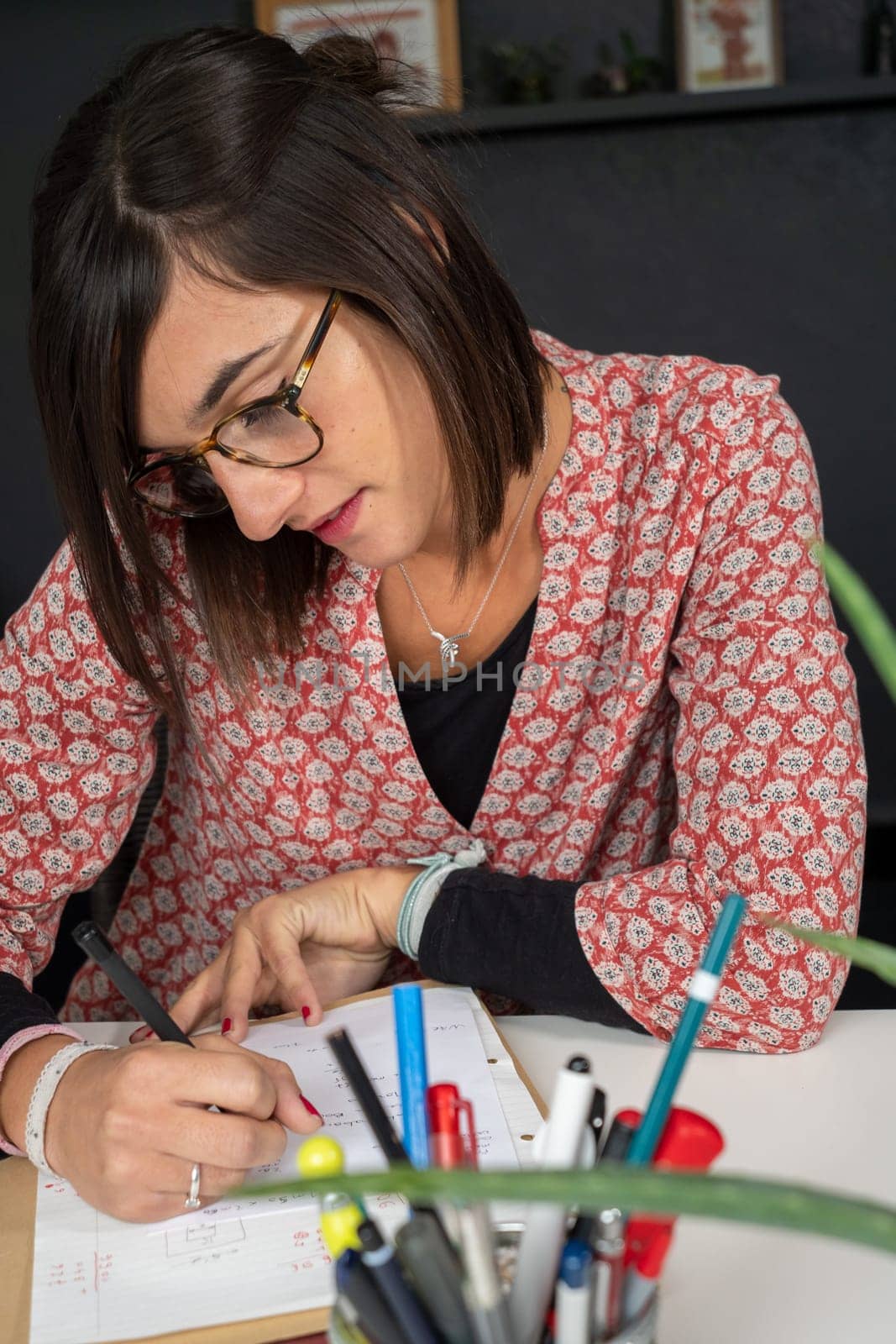 a portrait of smiling female student writing