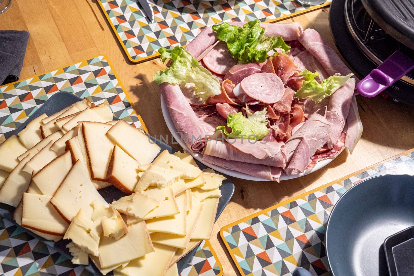 Raclette cheese and meat, a french tradition