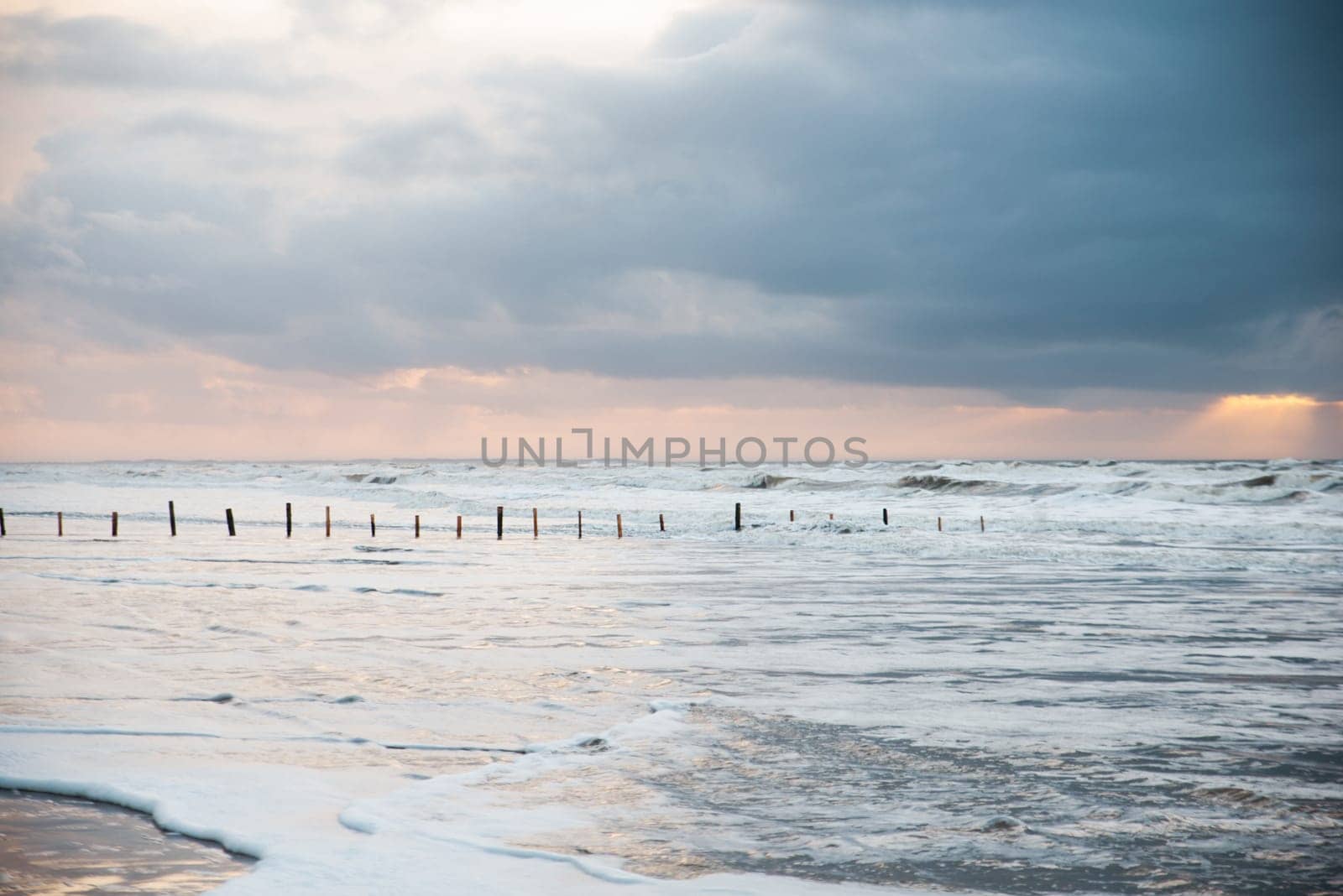 Wadden sea at low tide, North sea beach landscape, coast on Romo island in Denmark at sunset, vacation und lifestyle