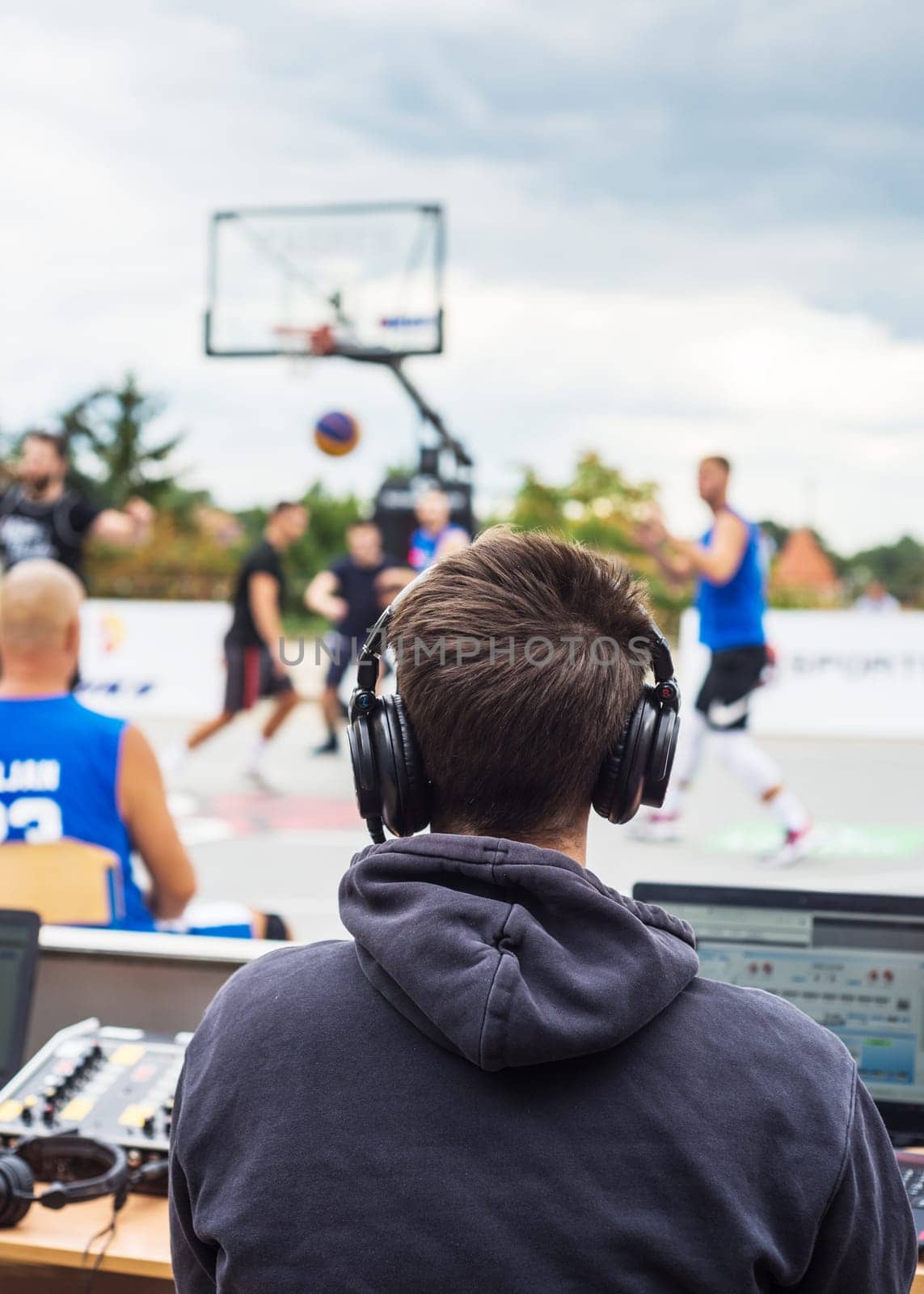 Reporter at basketball match