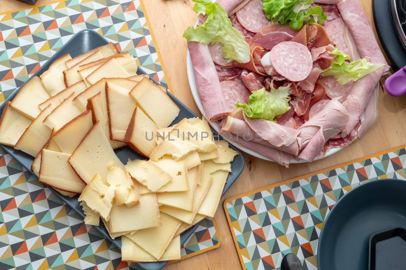 Raclette cheese and meat, a french tradition