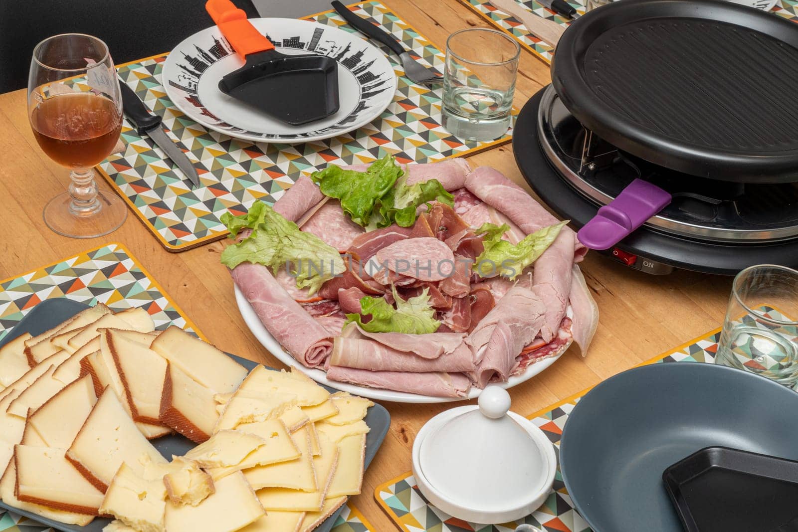 Raclette cheese and meat, a french tradition