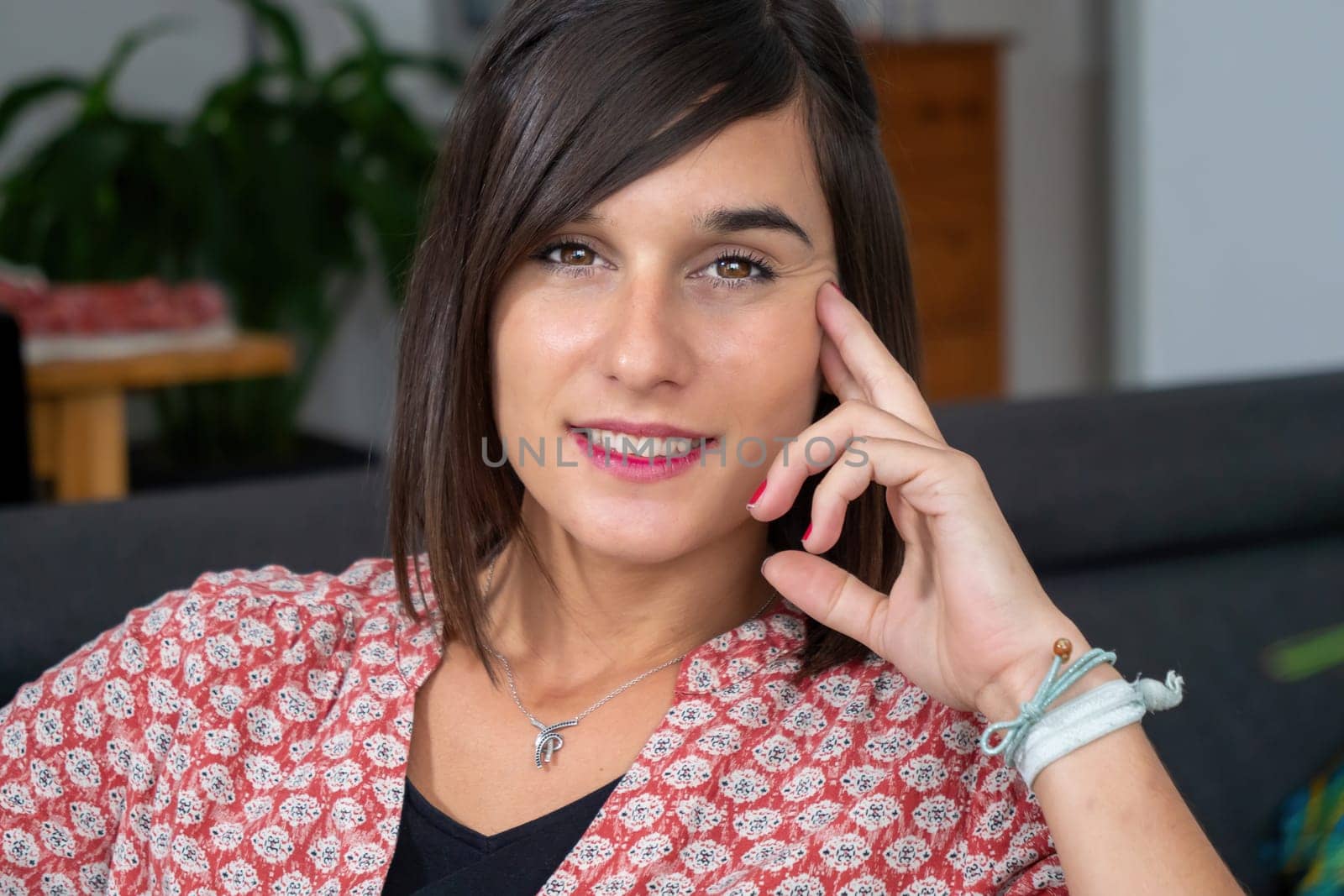 Portrait of a young brunette woman smiling