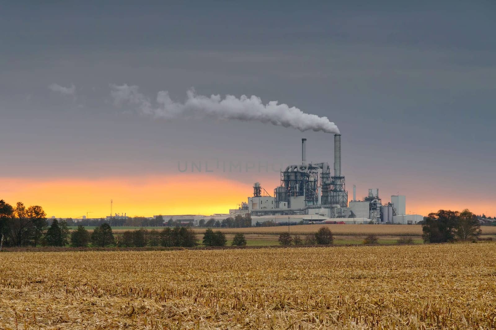 large industrial plant and smokestacks, major pollution