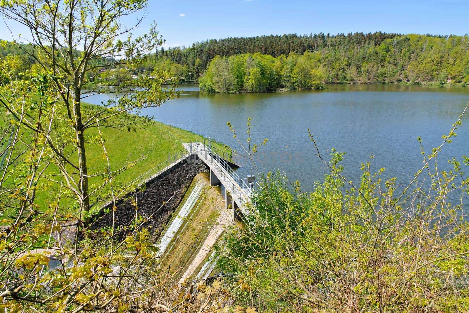 the Auma dam in the Vogtland with dam wall in spring, Germany