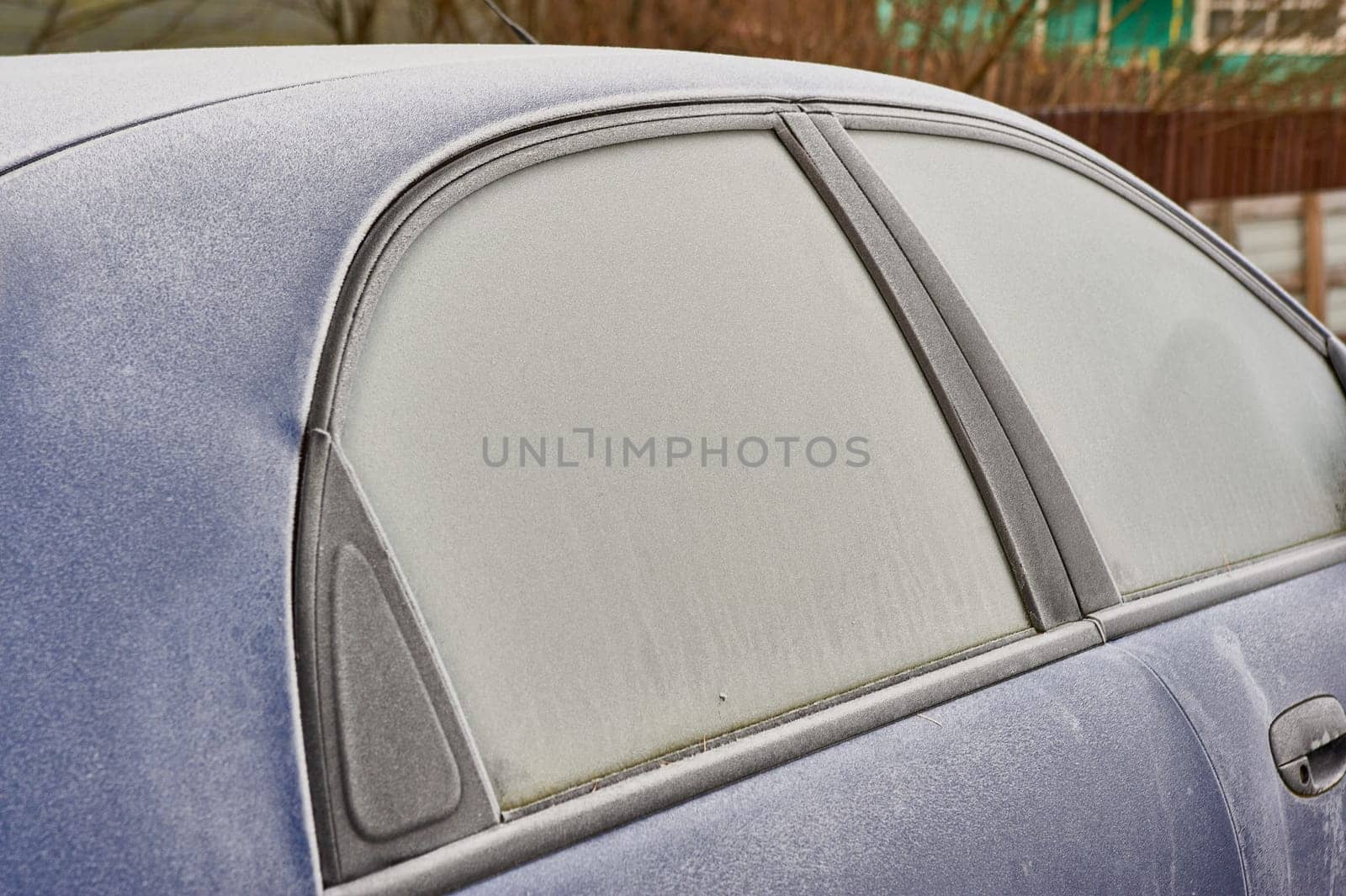 frozen windshield of a passenger car in winter. High quality photo