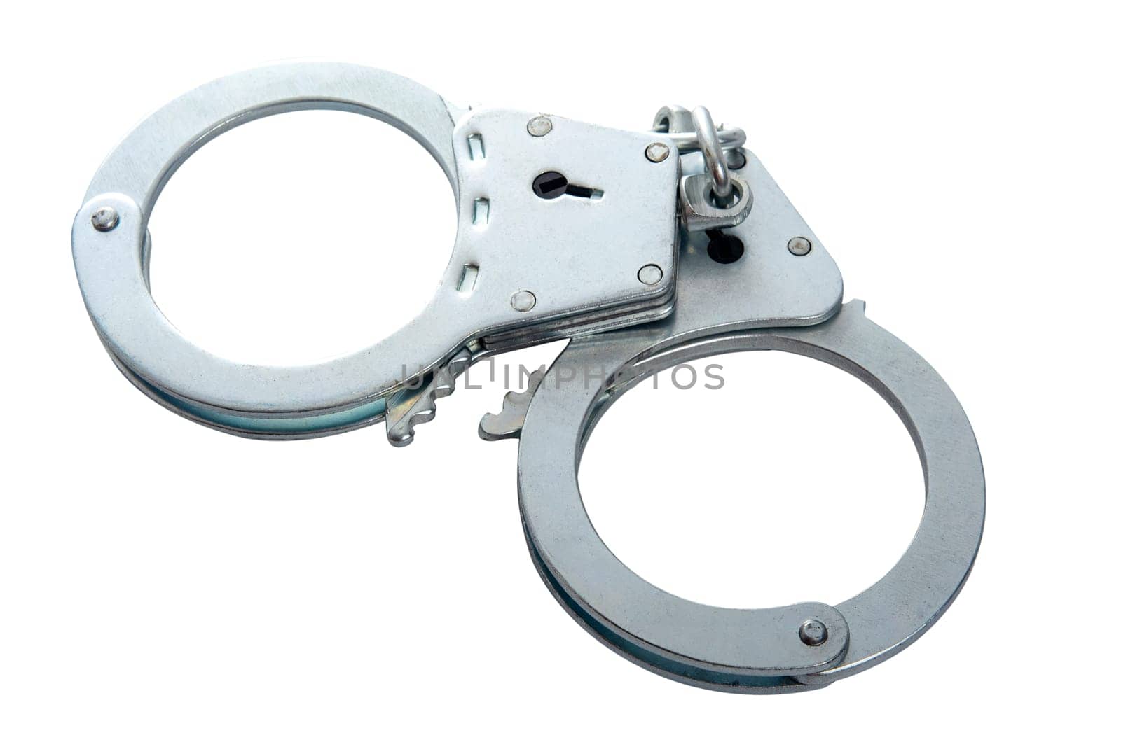 Metal handcuffs on a white isolated background, copy space. High quality photo