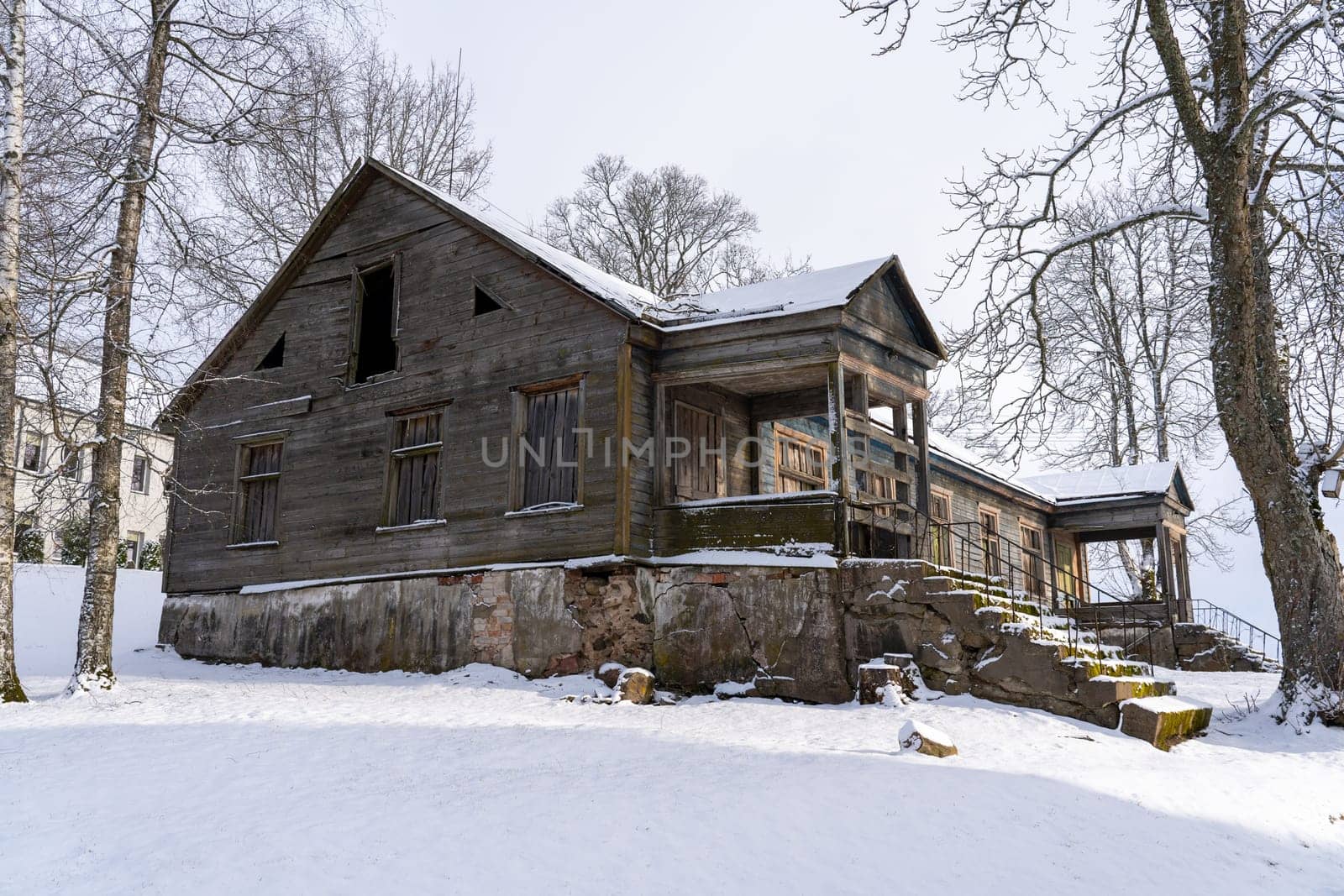 Old barn in the village on a winter day