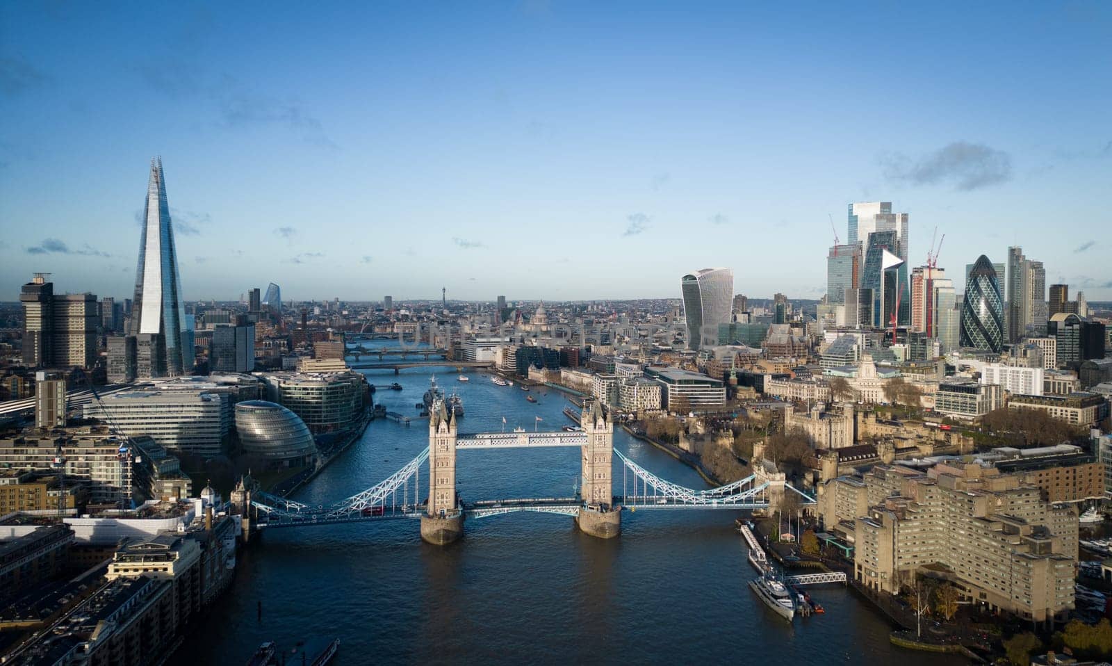 Typical aerial view over the city of London with Tower Bridge and River Thames - LONDON, UNITED KINGDOM - DECEMBER 20, 2022