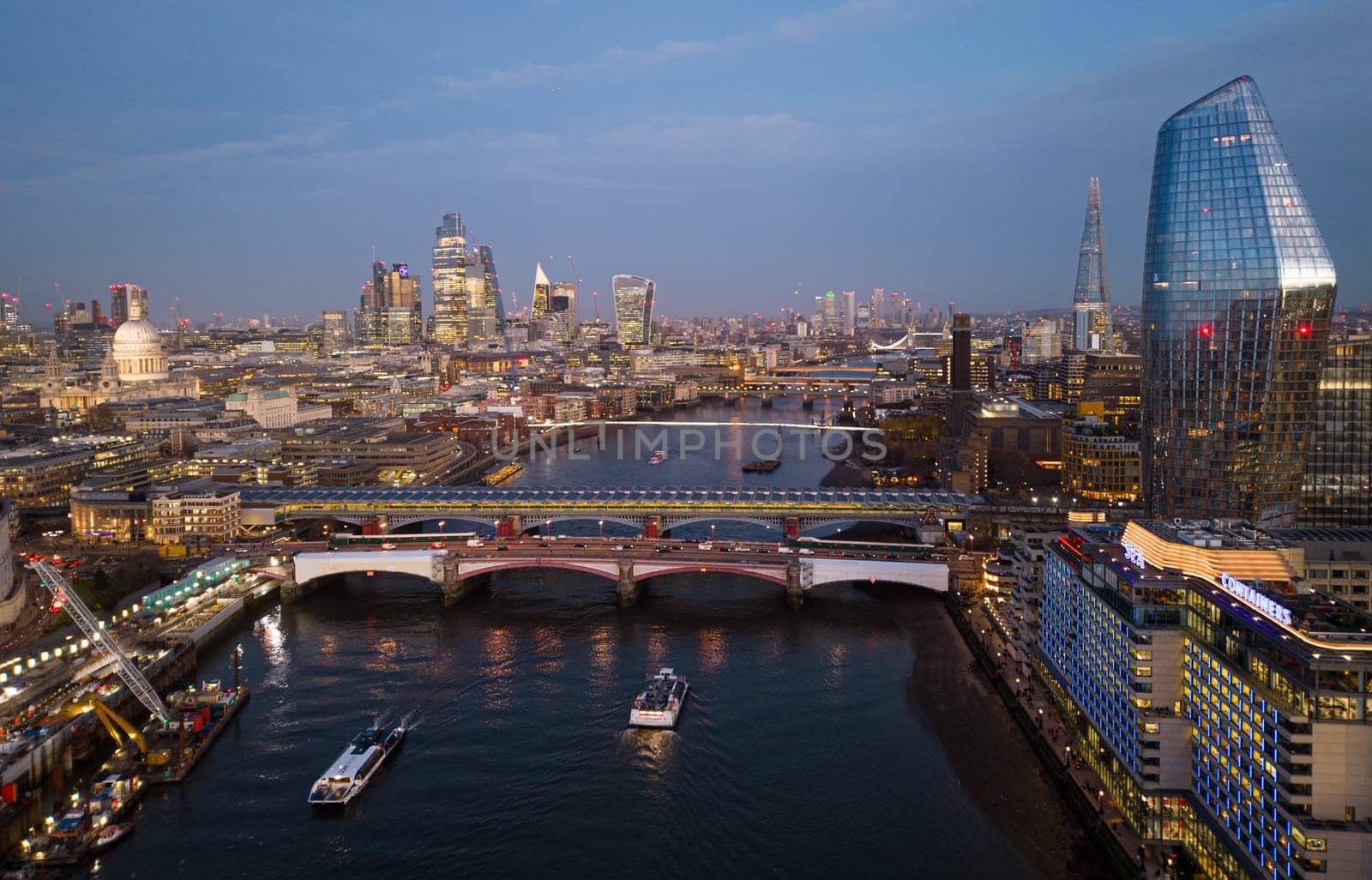 City of London in the evening - aerial view - LONDON, UNITED KINGDOM - DECEMBER 20, 2022