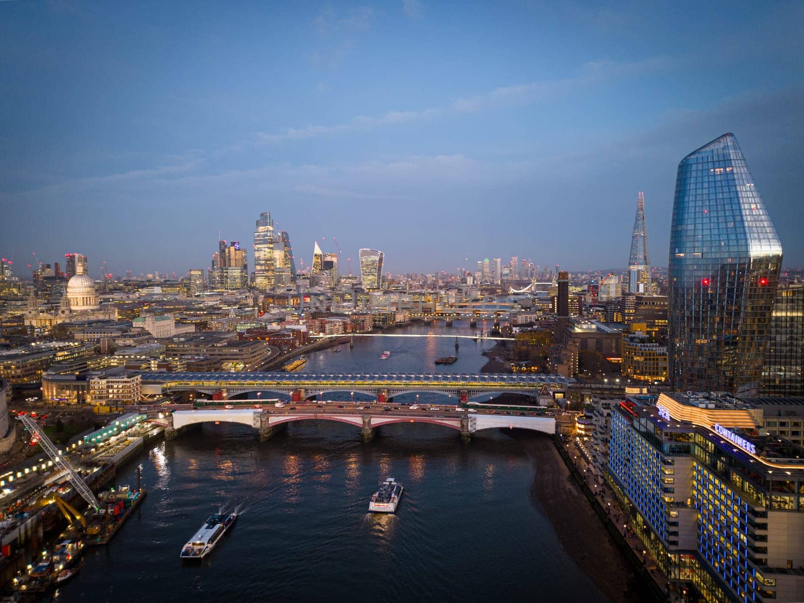 London with River Thames - amazing aerial view in the evening - LONDON, UNITED KINGDOM - DECEMBER 20, 2022