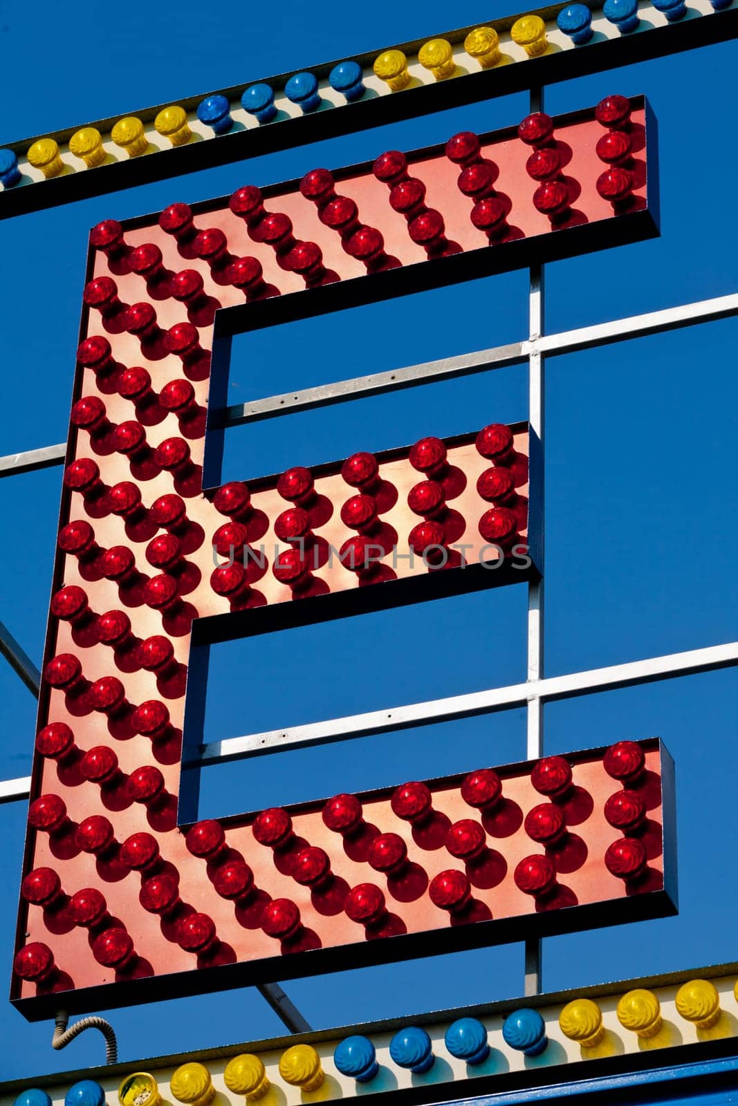 classic electric sign like the ones used in circus or old fashioned shops representing the E letter