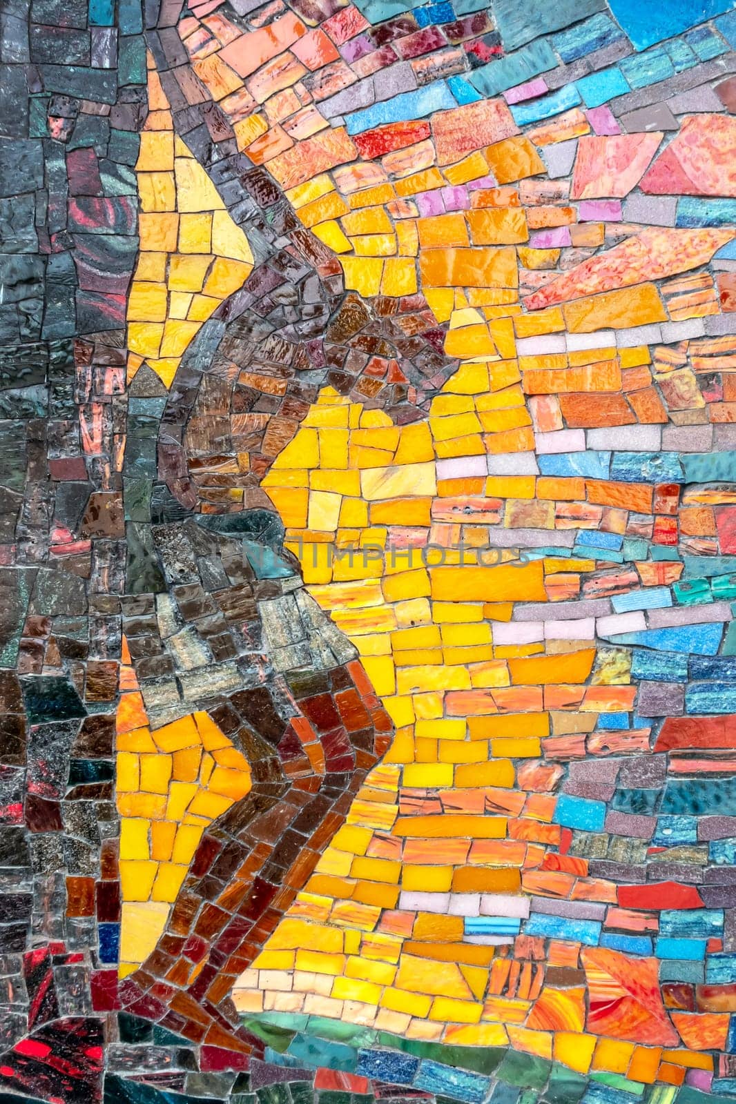 Mosaic depiction of Christ's body hanging on the cross. Concepts and religion.
