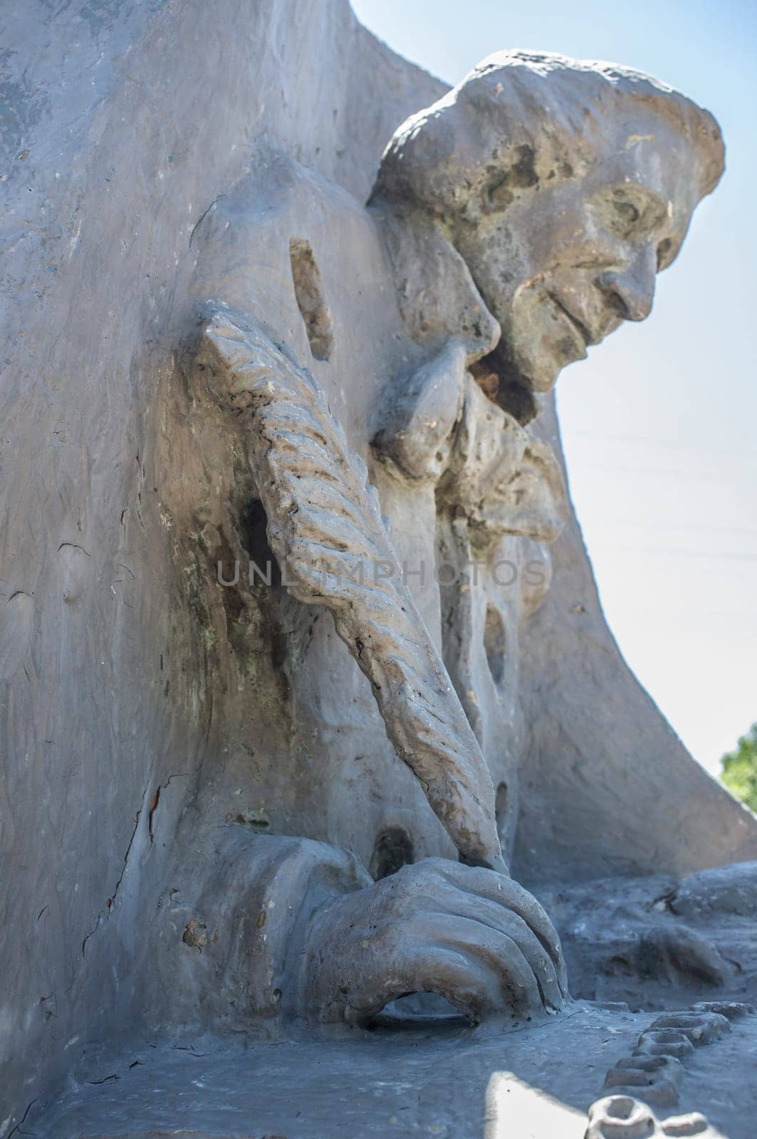La Albuera, Spain - Jun 12th, 2021: Hans Christian Andersen monument, representing the author writing The Ugly Duckling. Badajoz, Spain.
