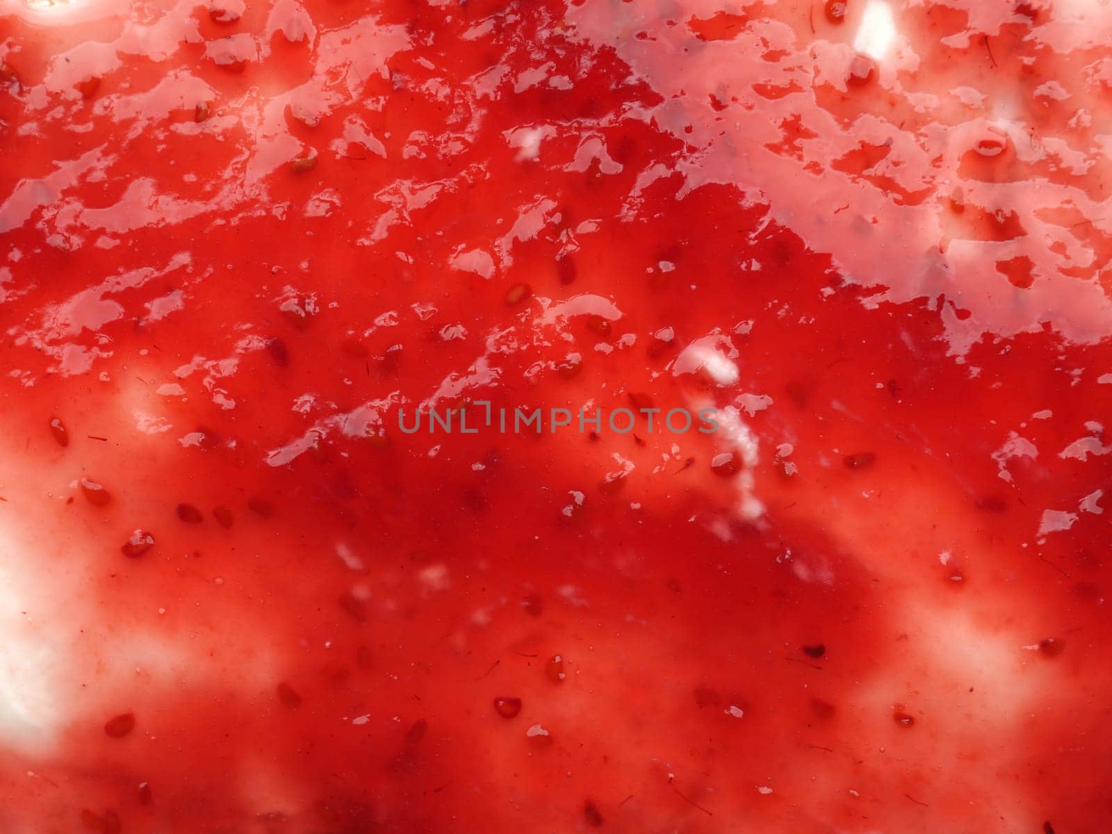 Texture of tasty organic raspberry jam on fresh organic curd using as background