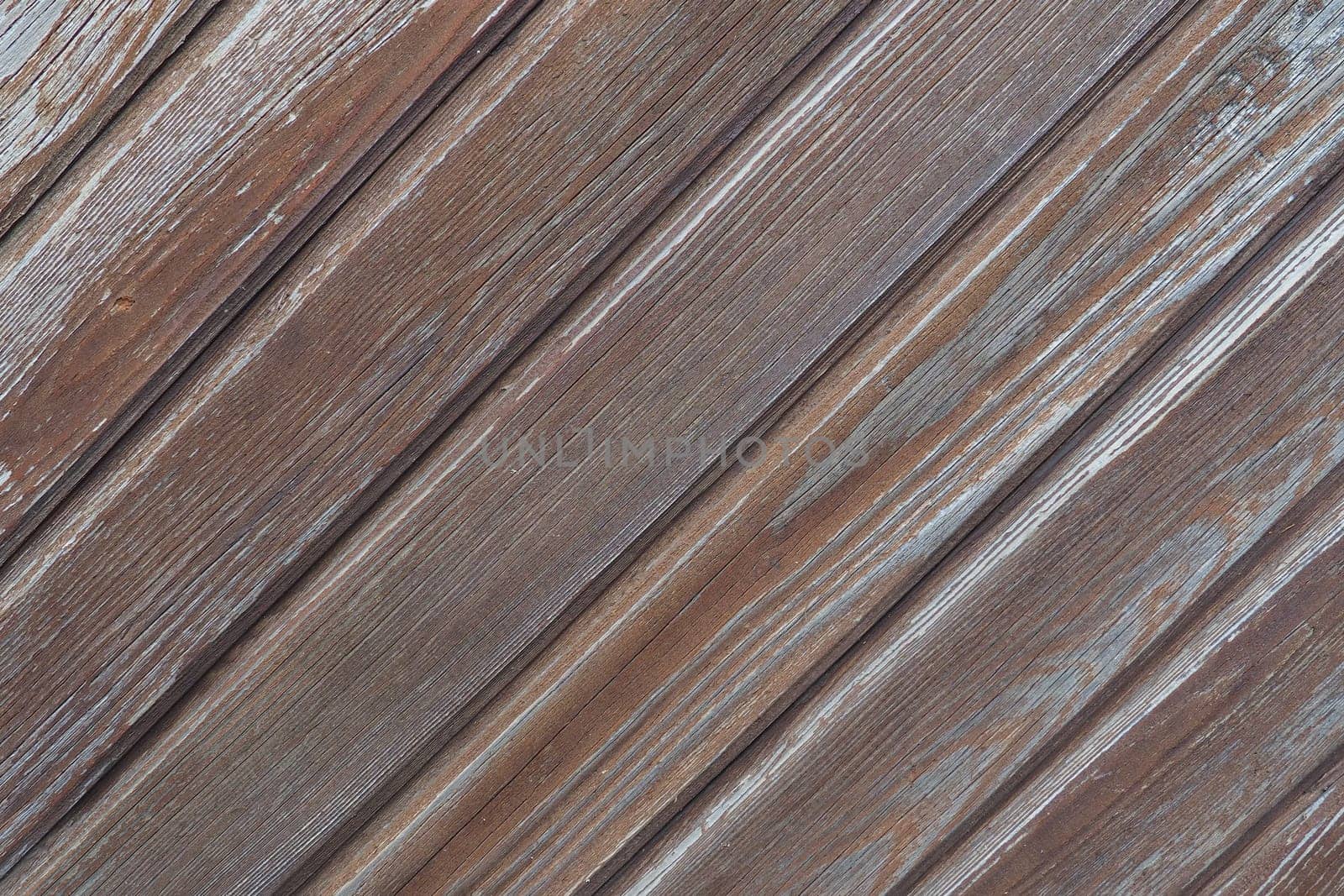 wooden boards arranged diagonally. Wood texture. Dark wood color. Background with copy space