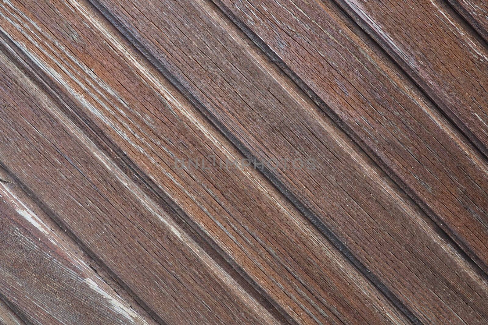 wooden boards arranged diagonally. Wood texture. Dark wood color. Background with copy space