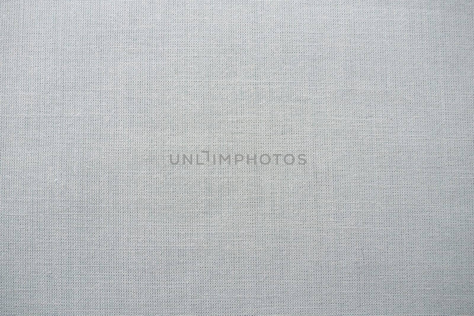 gray background fabric texture. A piece of woolen cloth is neatly laid out on the surface. Weave and textile texture. Dress fabric or for kitchen needs, tablecloth or curtains, close-up. Dash.