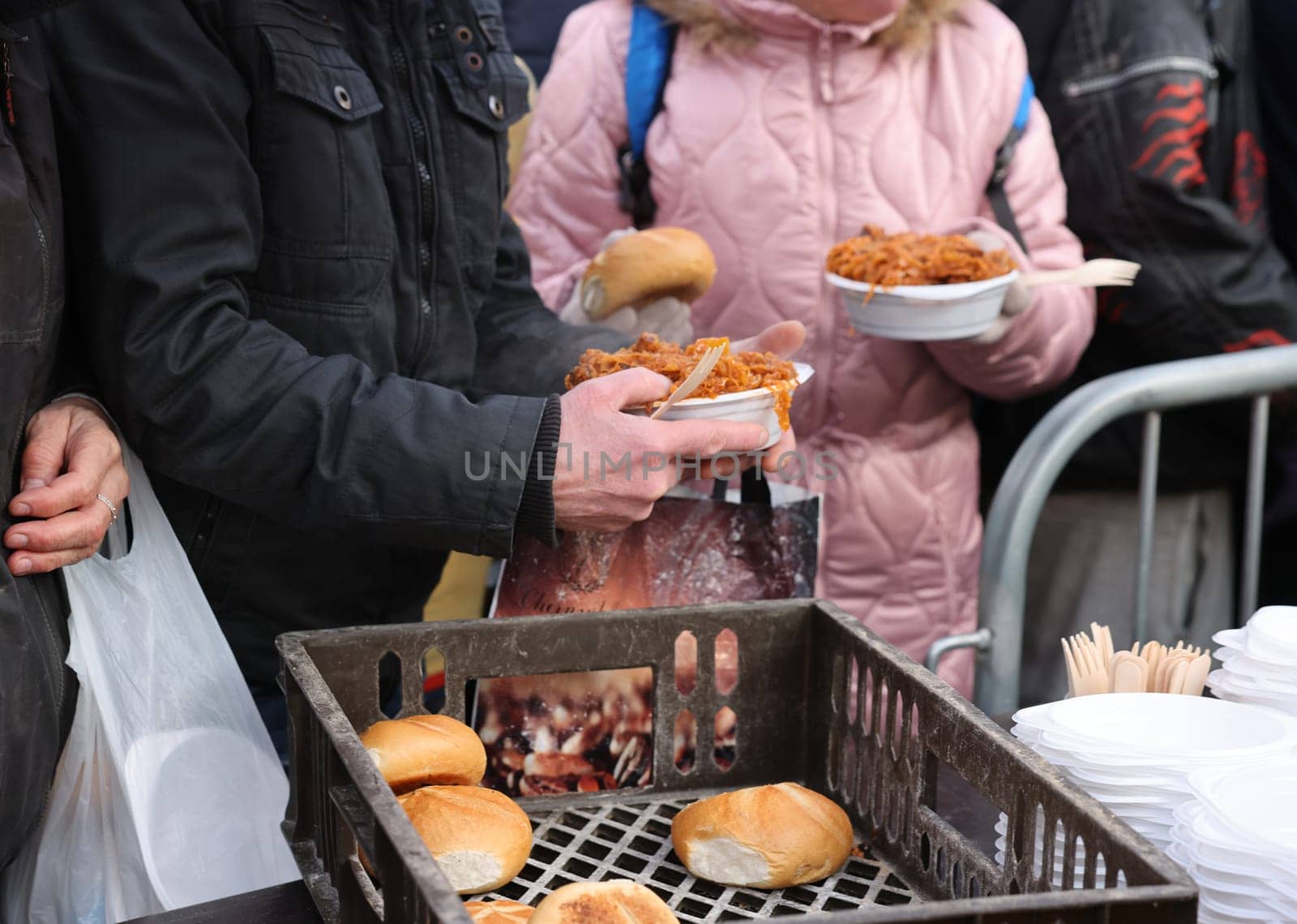 Krakow, Poland - Dec 18, 2022: Christmas Eve for poor and homeless on the Main Square in Cracow. The group Kosciuszko prepares the greatest eve in the open air in Krakow