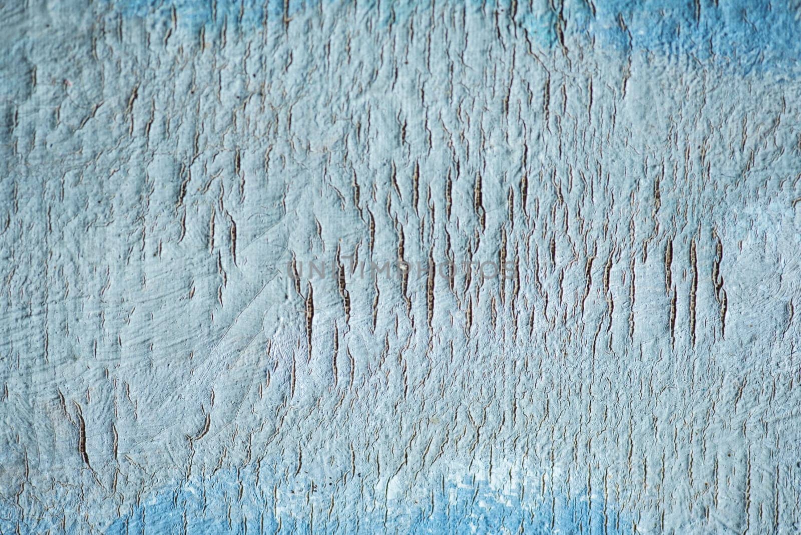 Abstract art canvas background with crack texture. Artistic design backdrop with blue oil paint.