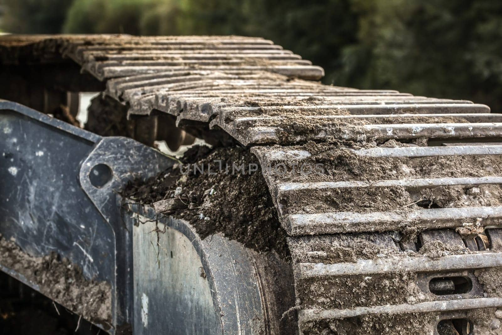 Detail of metal digger track soil left on surface . Construction concept.