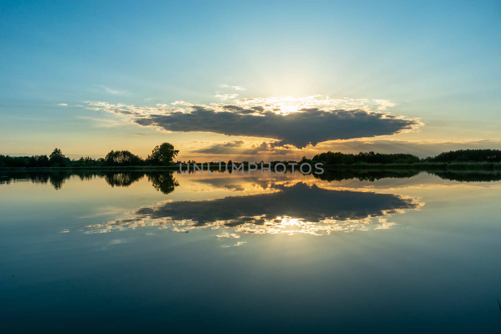 Reflection of cloud in the calm lake water
