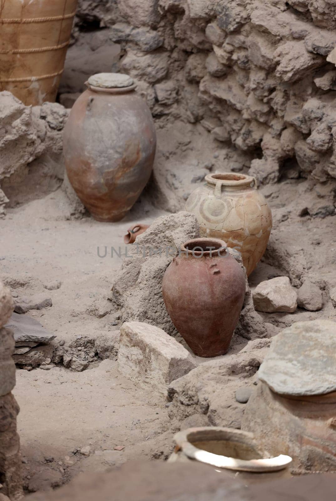 Santorini, Greece - July 01, 2021: Recovered ancient pottery in prehistoric town of Akrotiri, excavation site of a Minoan Bronze Age settlement on the Greek island of Santorini