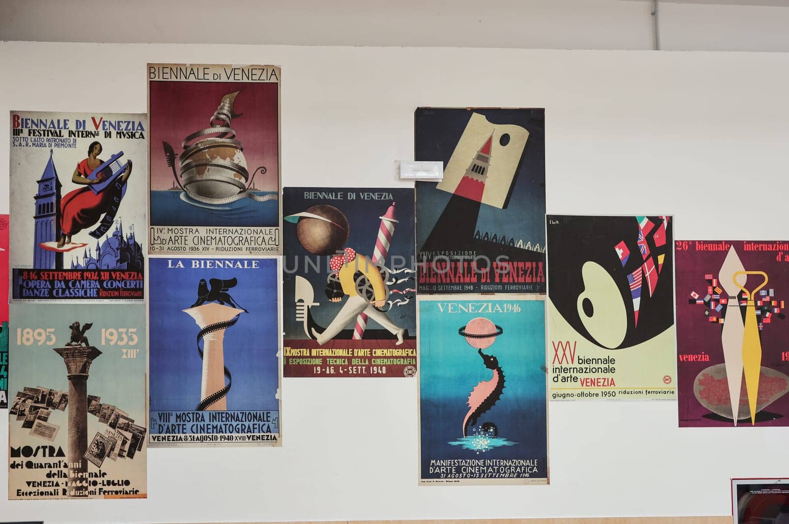 Venice, Italy - September 6, 2022:  59th Venice Art Biennale in Venice. Old posters advertising the Venice Biennale presented in the central pavilion in Giardini