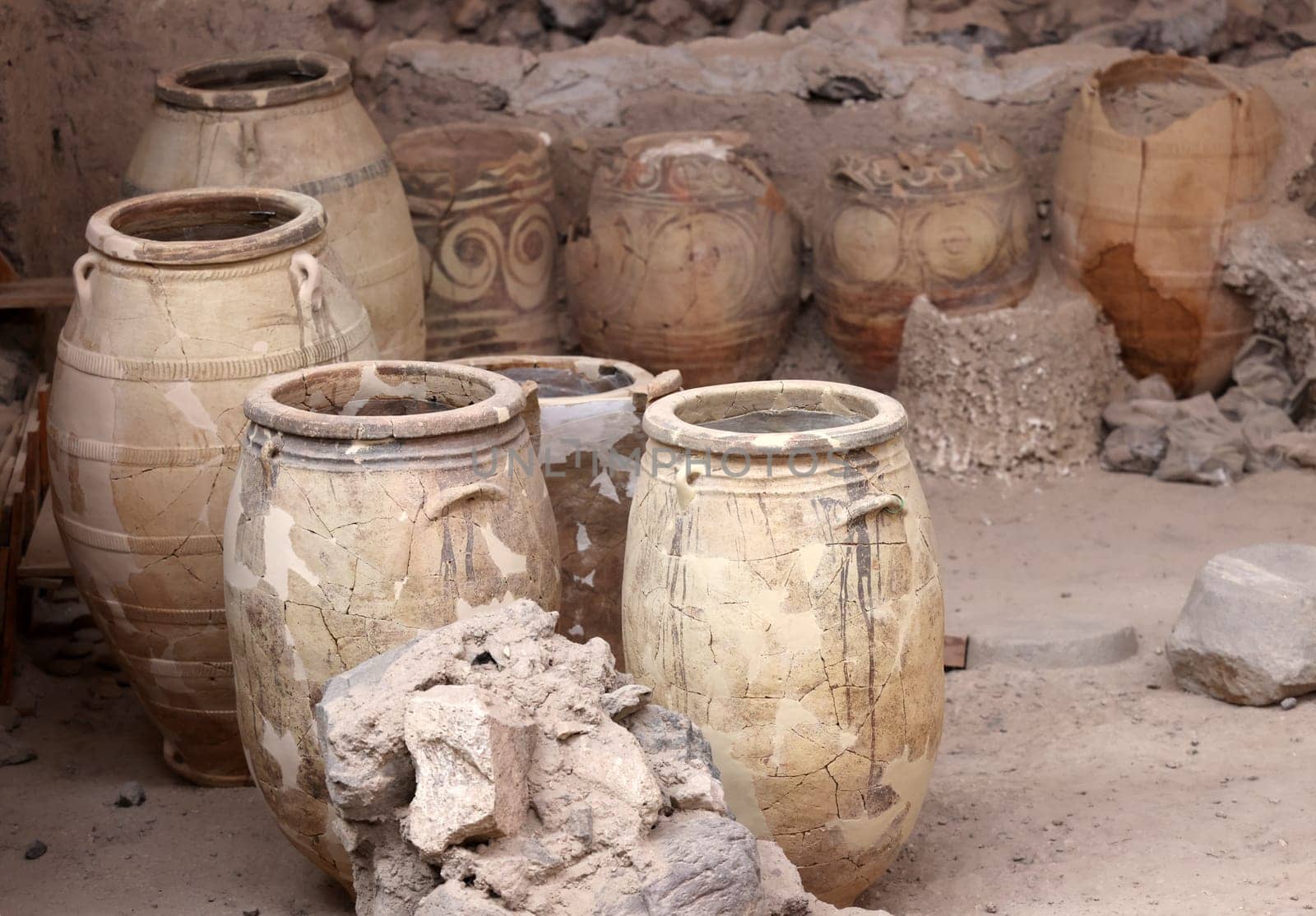 Santorini, Greece - July 01, 2021: Recovered ancient pottery in prehistoric town of Akrotiri, excavation site of a Minoan Bronze Age settlement on the Greek island of Santorini