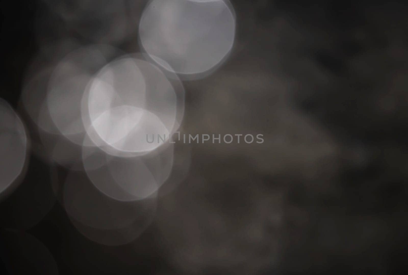 Light abstract dark bokeh christmas circle color glitter blurred black background