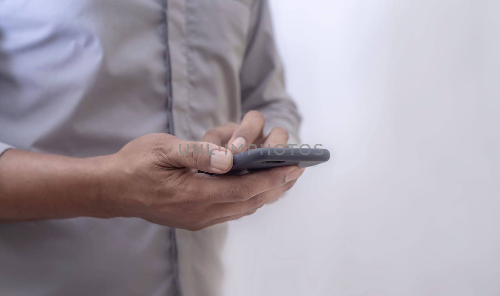 Human using smart phone mobile on blurred background