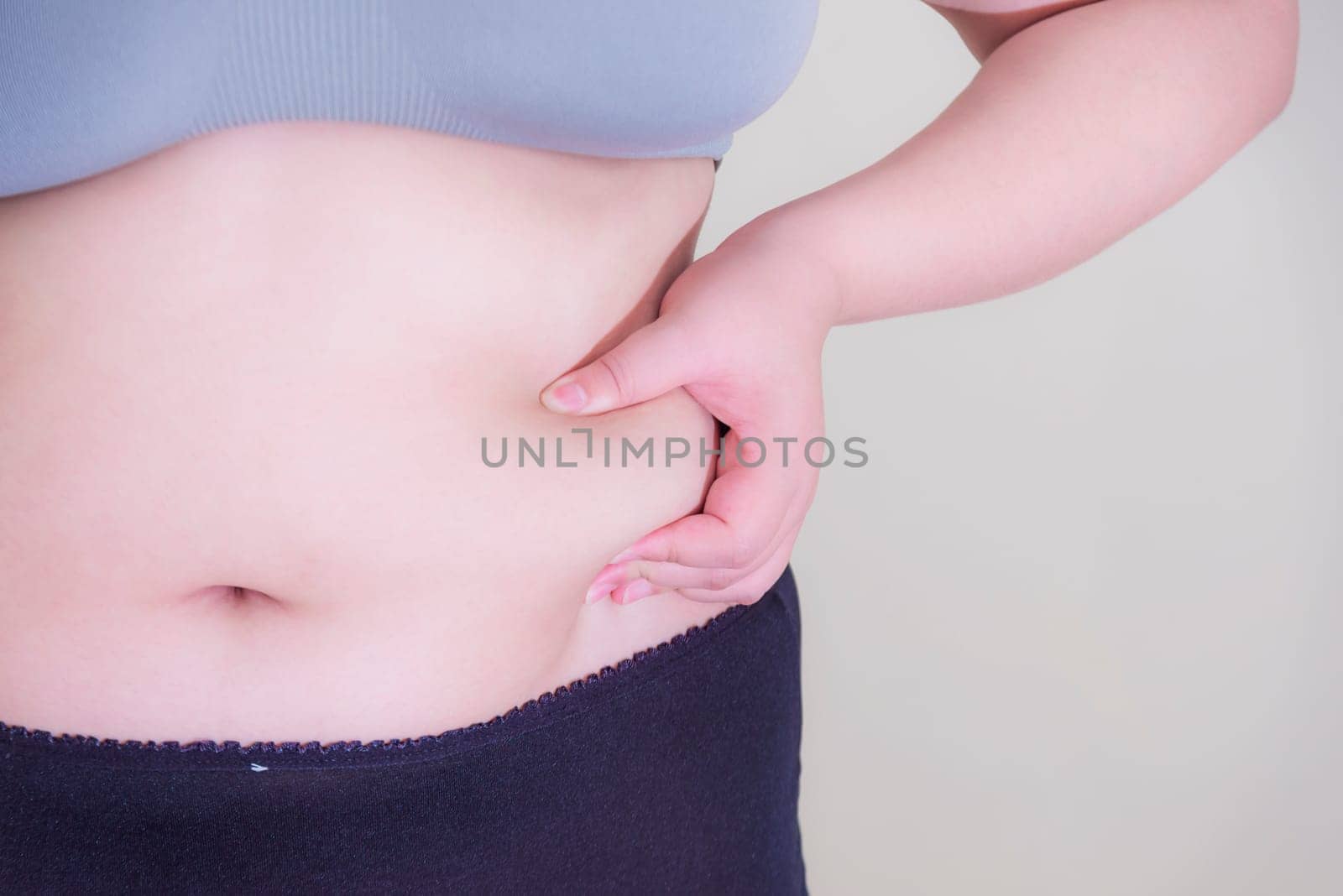 Fat woman, Shape up healthy stomach muscle, and diet lifestyle, to reduce belly concept.
