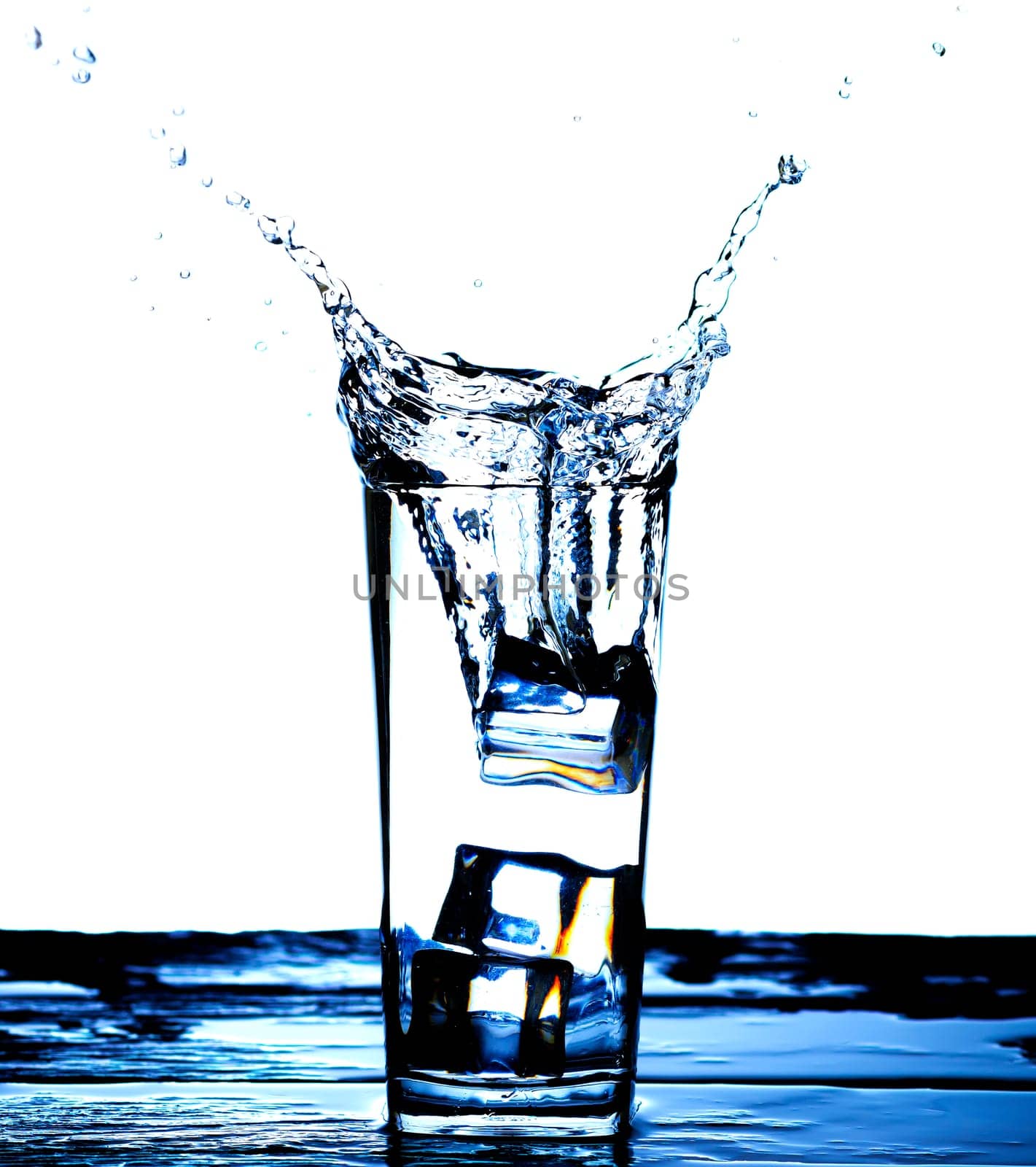 The image of pouring drinking water, into a glass, that makes one feel refreshed on blurred white background, Splashing water, Sparkling water