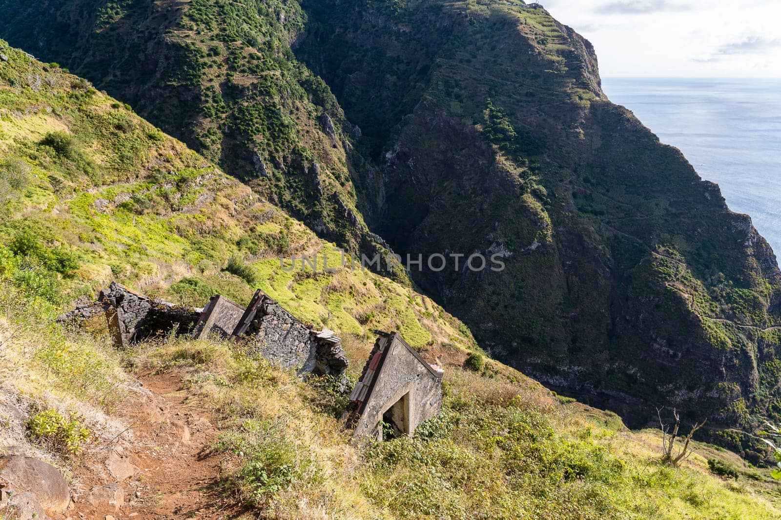 The abandoned house in the mountains near the ocean. Madeira island, Portugal.
